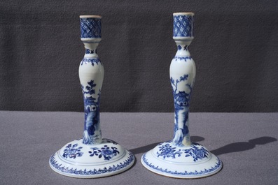 A pair of Chinese blue and white candlesticks, Kangxi/Qianlong